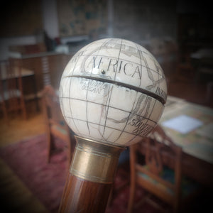 Late 19th Century Provocative Ivory Globe Topper with Cane.