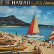 Load image into Gallery viewer, Cover of a vintage photo booklet of Hawaii  featuring a Hawaiian beach scene with people on the sand, tropical mountains, blue ocean, and two sailboats. Large text at the top reads “HERE IS HAWAII - All in Natural Color.
