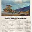 Load image into Gallery viewer, A vintage 1969 Union Pacific Railroad calendar page featuring a large illustrated scene of freight trains on tracks with mountains in the background, above a full monthly calendar grid.
