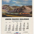 Load image into Gallery viewer, Vintage Union Pacific Railroad October 1969 calendar page featuring a mountain landscape with a freight train above a printed calendar grid and railroad centennial text.
