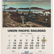 Load image into Gallery viewer, Vintage Union Pacific Railroad calendar page from May 1969, featuring a large illustrated scene of a steam train traveling through a desert landscape with passengers and workers on the tracks, plus a calendar grid and commemorative text for the railroad's 1969 centennial.
