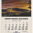 Load image into Gallery viewer, Vintage August 1969 Union Pacific Railroad calendar page featuring a painted train scene with mountains and a dramatic sunset sky, plus printed calendar grids for July and September and a centennial logo at the bottom.
